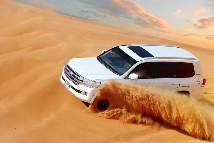 Experience the vast rolling dunes of the Dubai desert as you navigate the sandy landscape in style leading to an unforgettable evening of dining and entertainment.